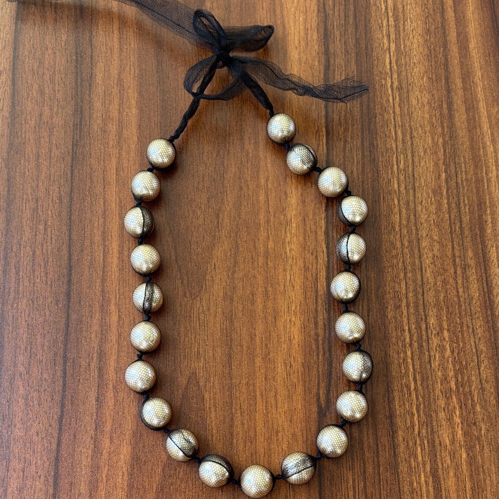 Designer Lanvin pearls with black net tie